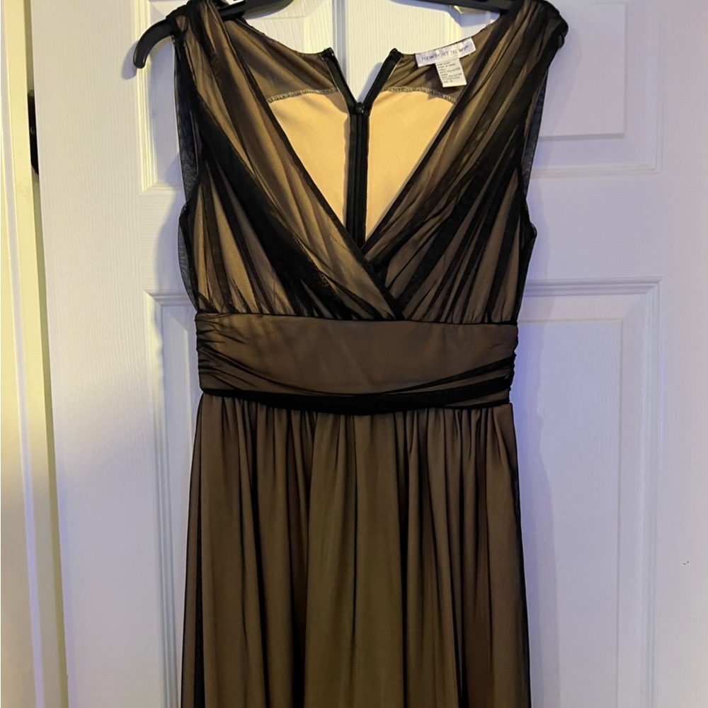 Might have been worn once. There is a type of overlay over the silk part.